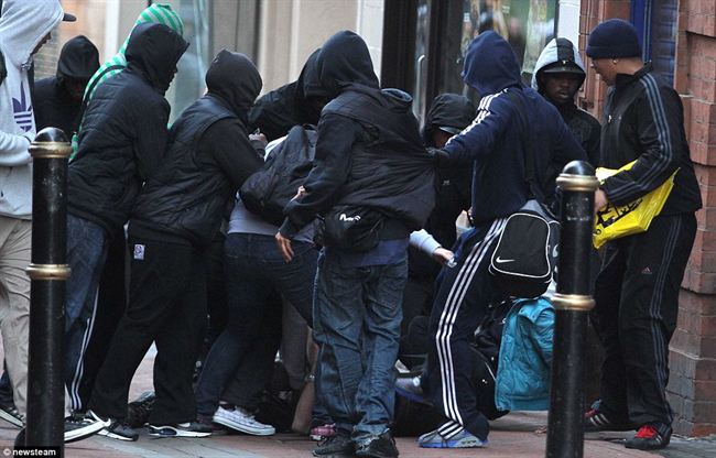 Mindlessgroup youths attacks helpless photographer Brimingham the violence spread north last night